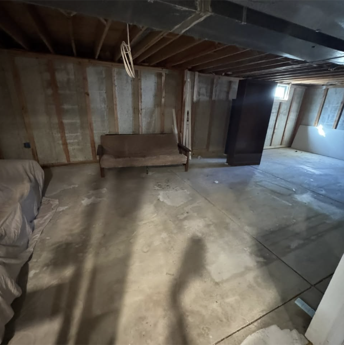 Basement: Unfinished Storage to Finished Living Space - before